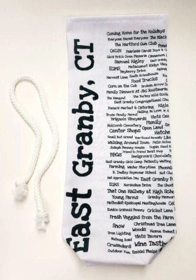 A white and black bookmark with words on it