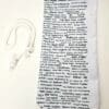 A white tie with black writing on it