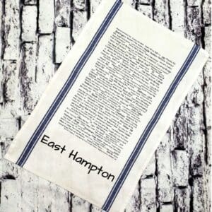 A towel that has the words east hampton written on it.