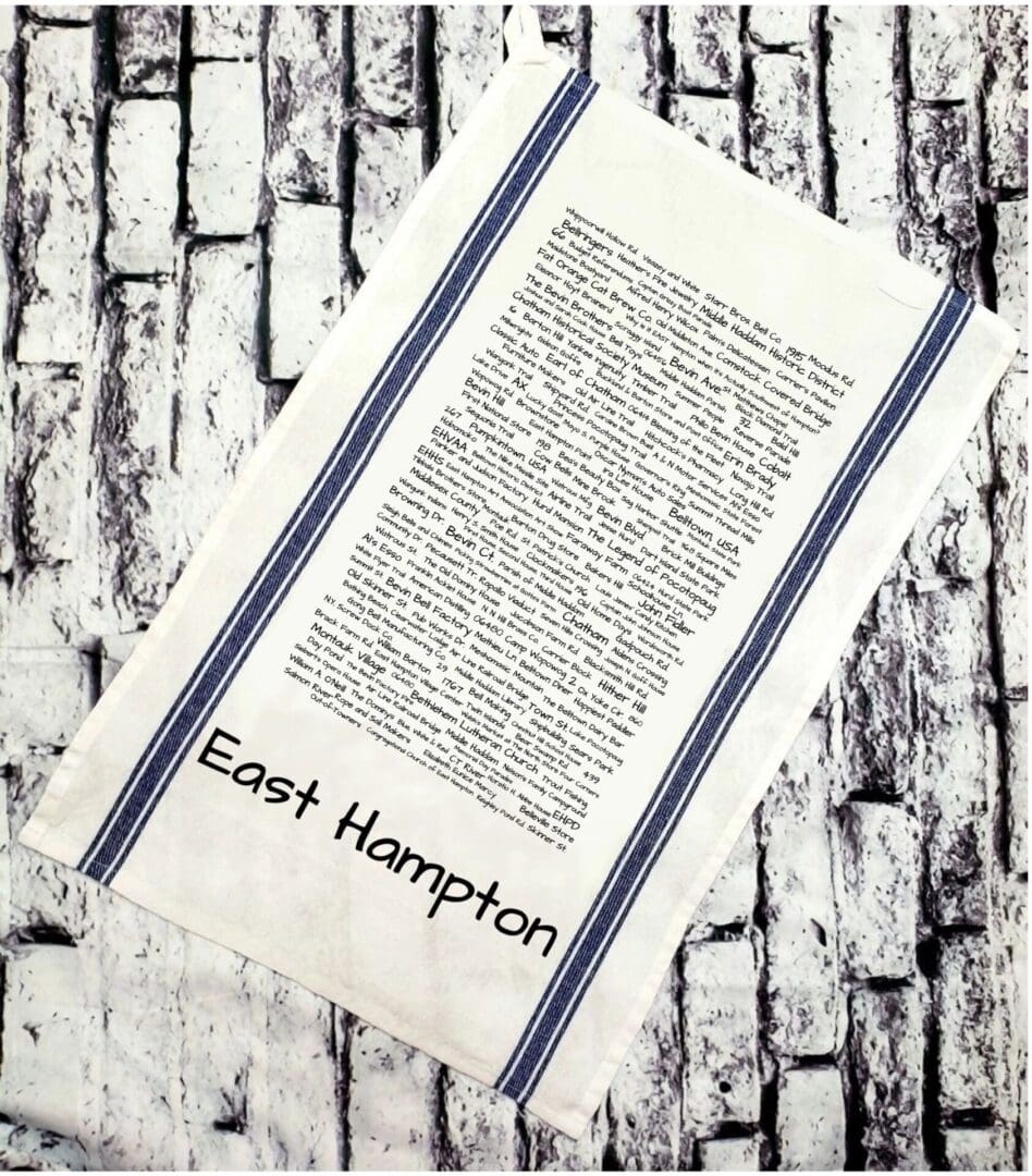 A towel that has the words east hampton written on it.