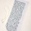 A white paper bag with the words " to be read " written on it.