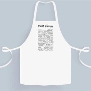 A white apron with a black and white design.