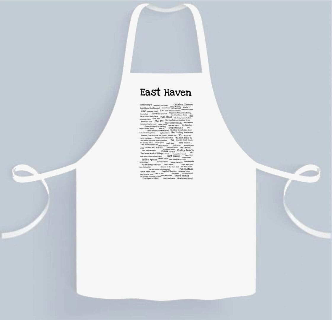 A white apron with a black and white design.