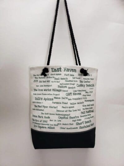 A black and white bag with words written on it