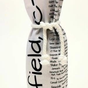 A bottle wrapped in newspaper with the words " field " written on it.