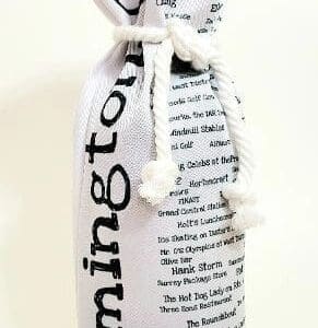 A bottle of wine wrapped in newspaper with rope.