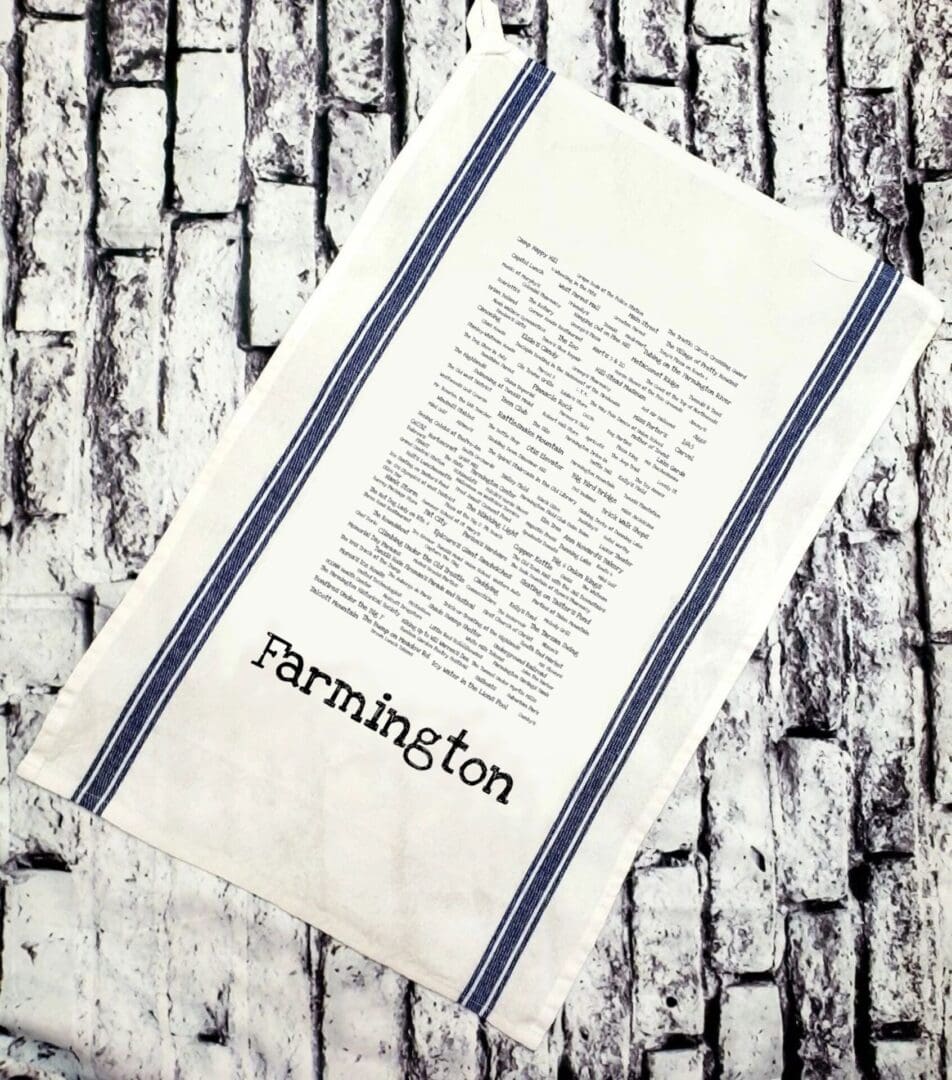 A towel that has the word farmington written on it.