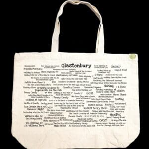 The front half of a canvas tote bag featuring fun trivia about Glastonbury!