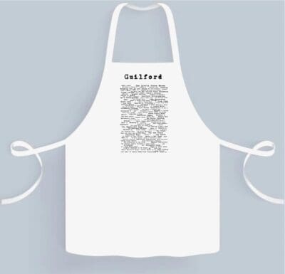 A white apron with an image of the word " self-food ".