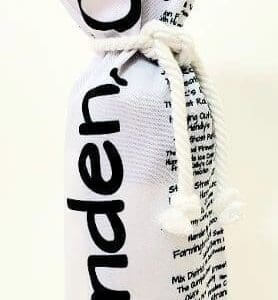 A bottle of wine in a white bag