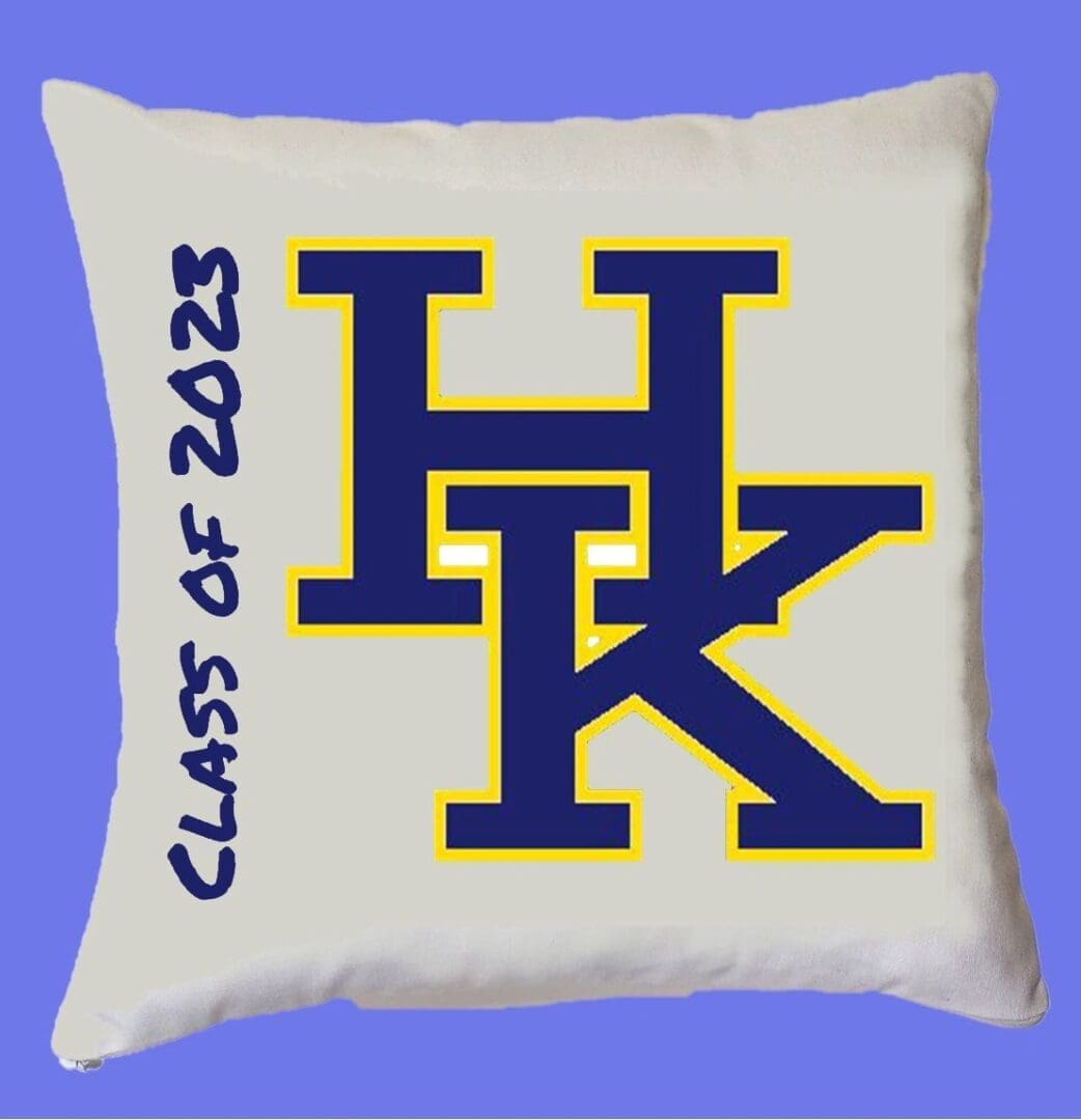 A pillow with the letters h and k on it.