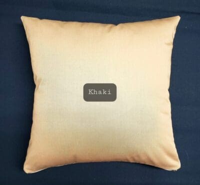 A pillow with the name " khizi " written on it.