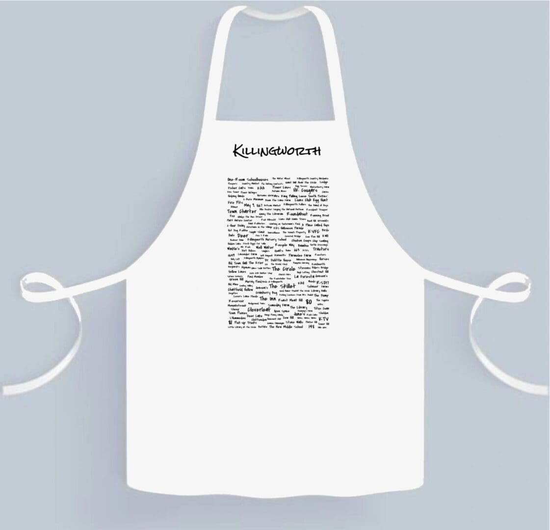 A white apron with black writing on it.