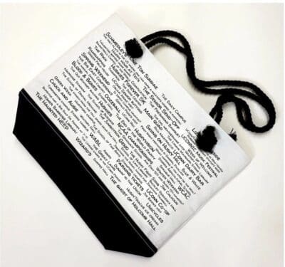 A white and black bag with words on it