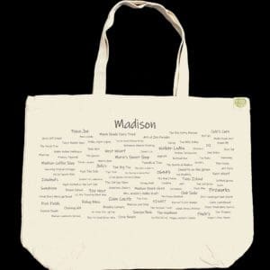 The front half of a canvas tote bag featuring fun trivia about Madison!