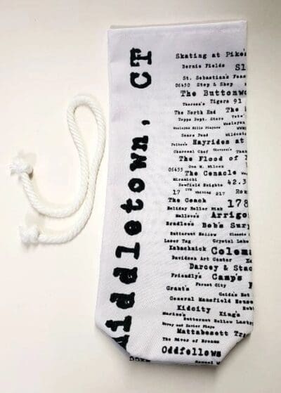 A white tie with black text and words