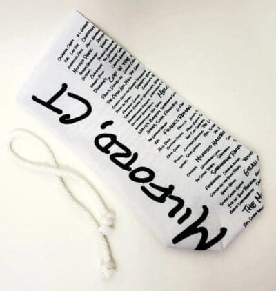 A white and black bookmark with words written on it