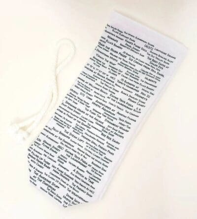 A white paper bag with words written on it.