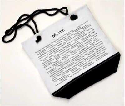 A white bag with black string and the word " poetic ".