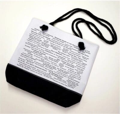 A white bag with black cord and a picture of the word " dictionary ".