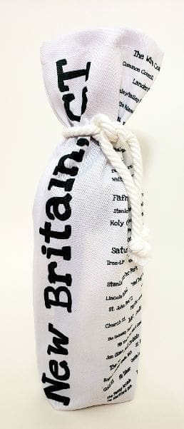 A white bottle bag with the word britain written on it.