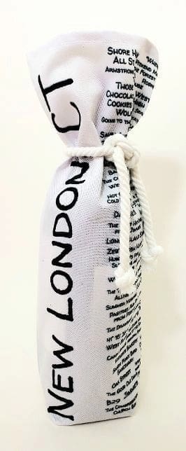 A bottle of wine in a bag with the word london written on it.