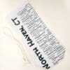 A white bag with black writing on it
