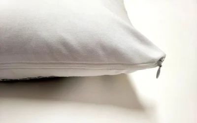 A pillow with a white cover on it