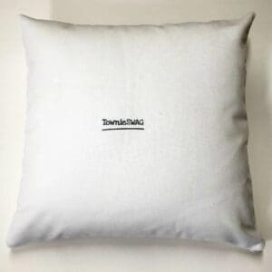 A white pillow with a picture of a person on it.