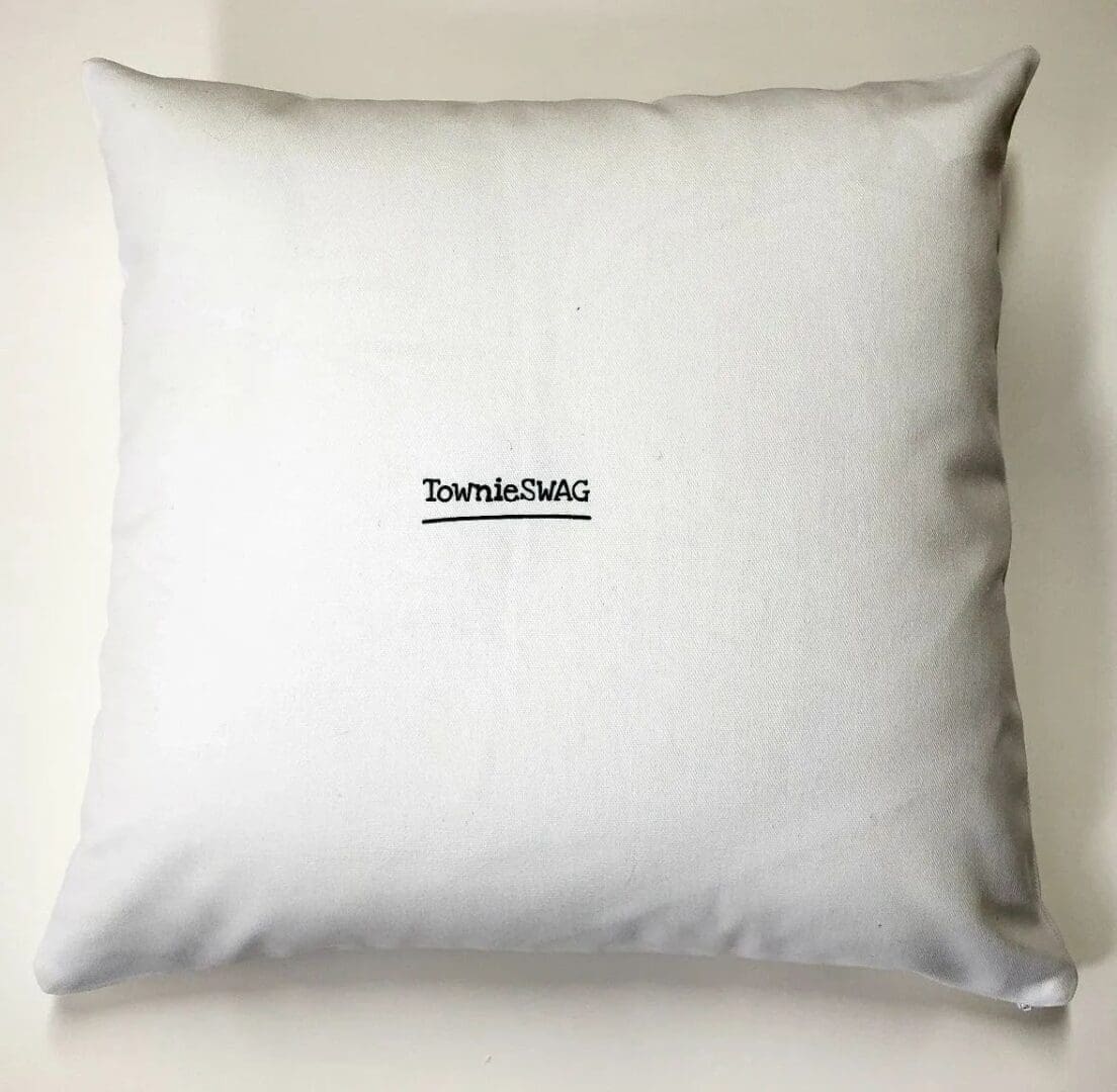 A white pillow with a picture of a person on it.