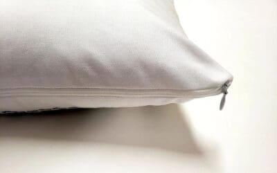 A close up of the pillow on a bed