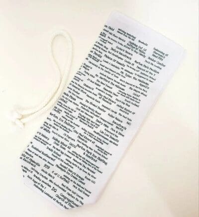 A white paper bag with some writing on it