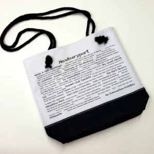 A bag with black cord and white paper.