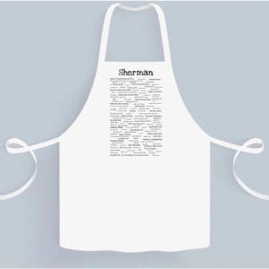 A white apron with the word " derriere " written on it.