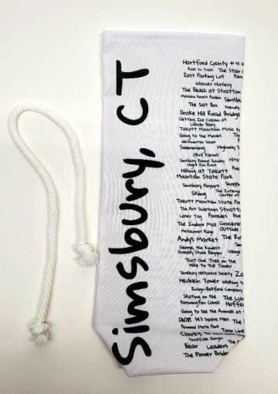 A white bookmark with black writing and words