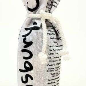 A bottle of wine wrapped in newspaper with string.