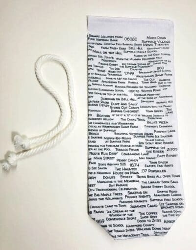 A white tie with many words written on it