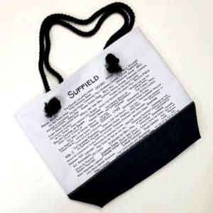 A white bag with black handles and a text on it.