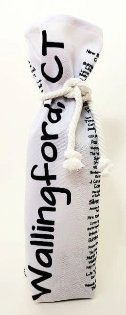 A white bottle with black writing on it