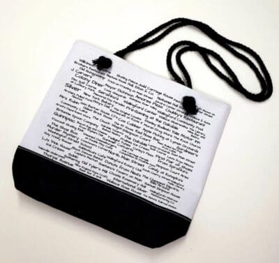 A black and white bag with words on it