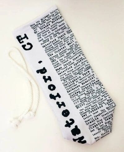 A tie that has words written on it.