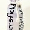 A bottle of wine is wrapped in a white bag.