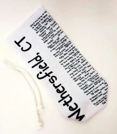 A white and black bookmark with words on it