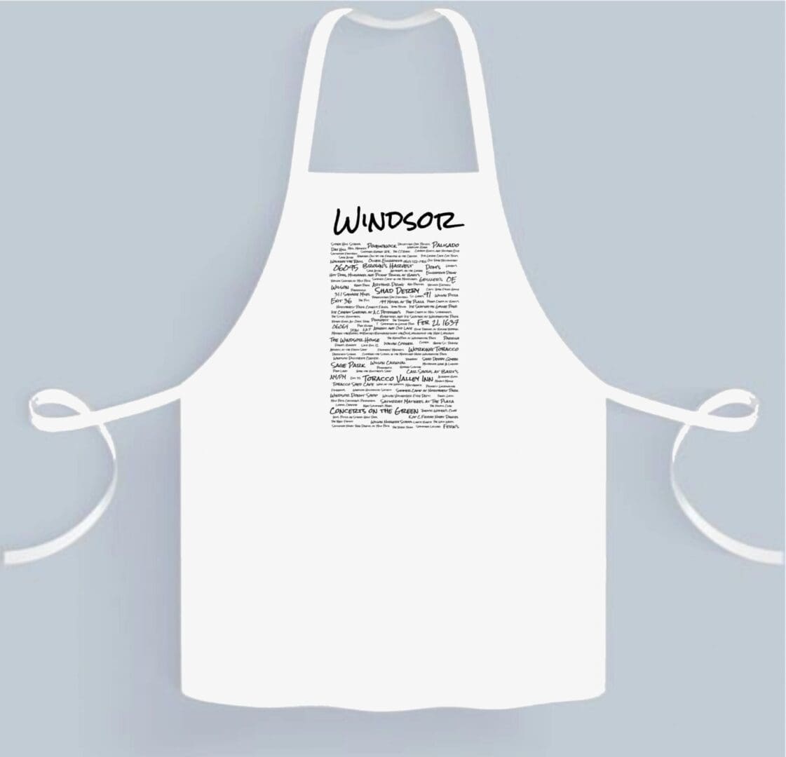 A white apron with writing on it.