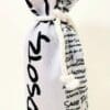 A wine bag with the word " sososo " written on it.