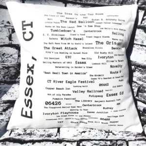 A pillow with the words essex, ct written in black and white.