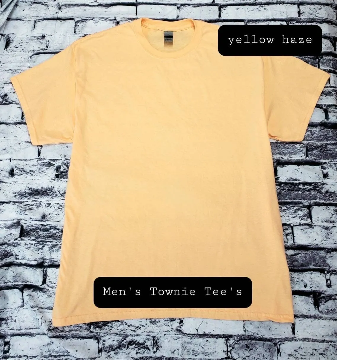 A yellow t-shirt with the words " men 's townie tre 's ".