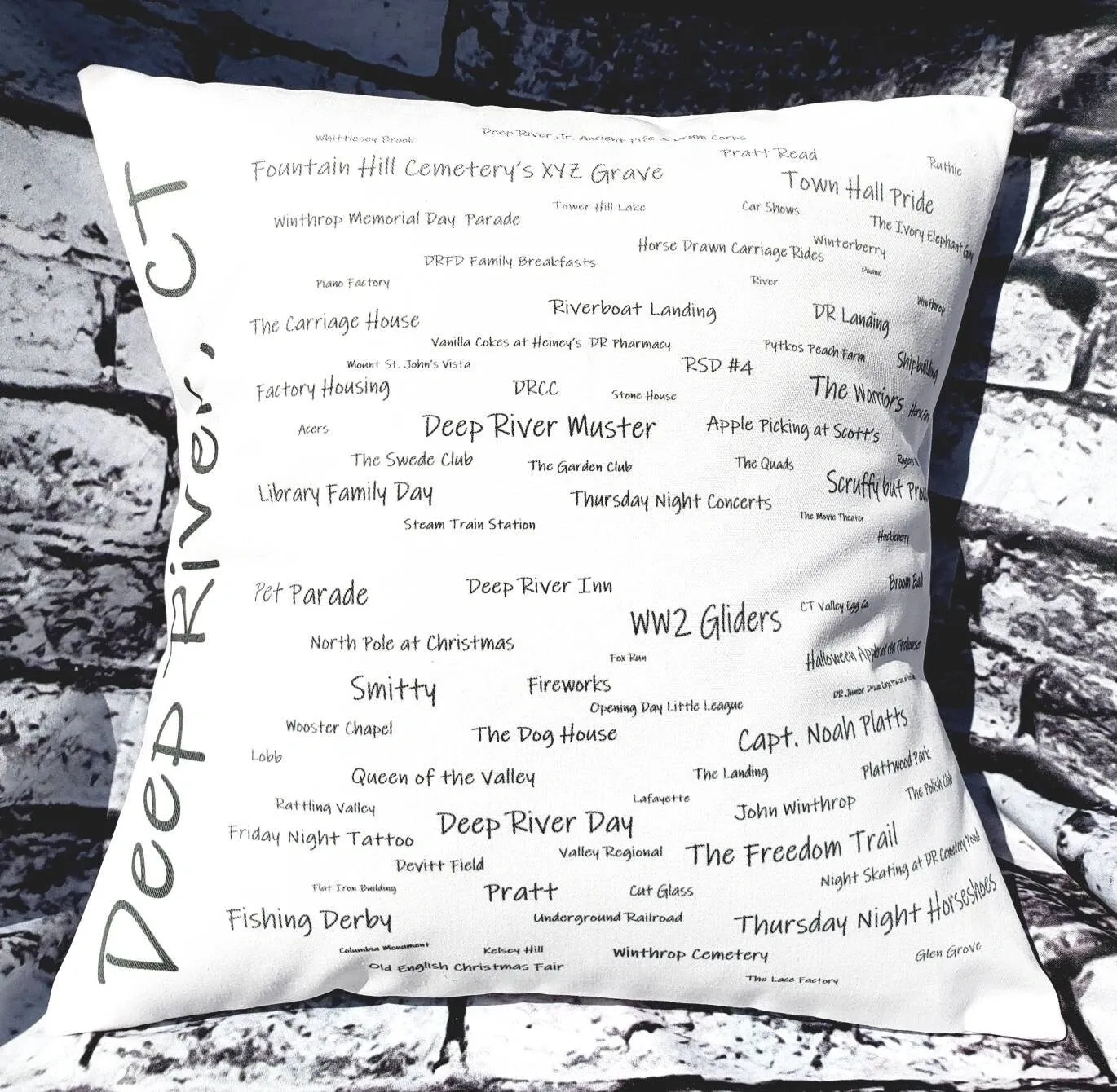 A pillow with many words written on it