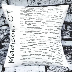 A pillow with many different words written on it