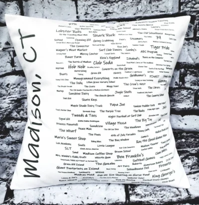 A pillow with many different words written on it